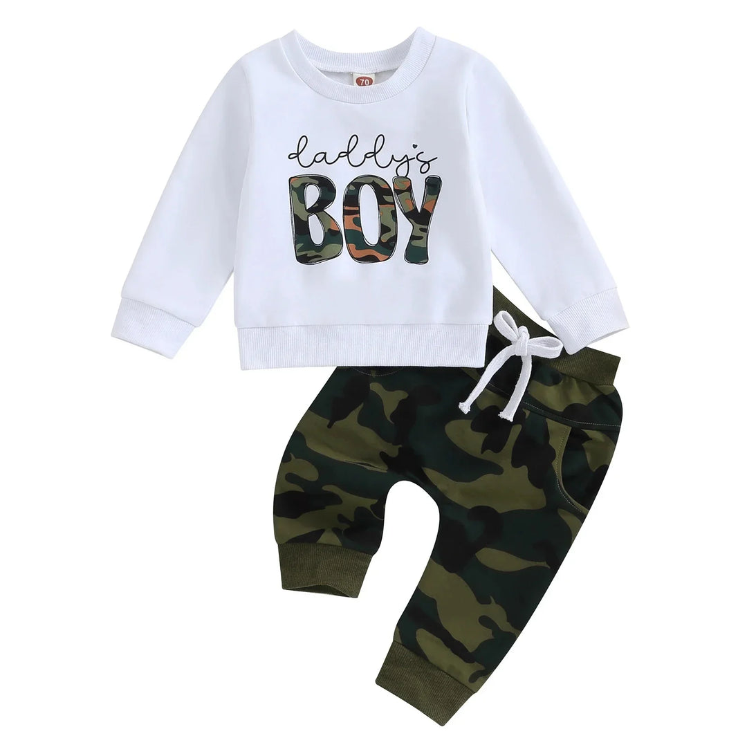 Toddler outfit with white long-sleeve top saying Daddy's Boy and camo print pants