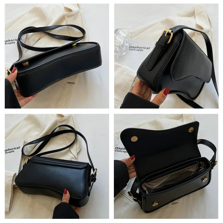 Black leather crossbody bag with gold buckle, curved shape, and zippered interior pocket