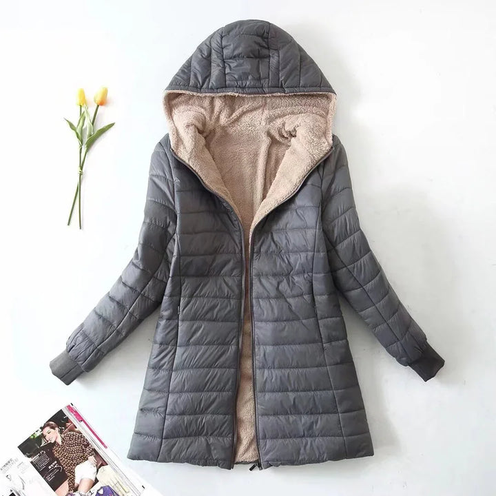 Gray quilted women's winter coat with beige fleece lining and hood on white background