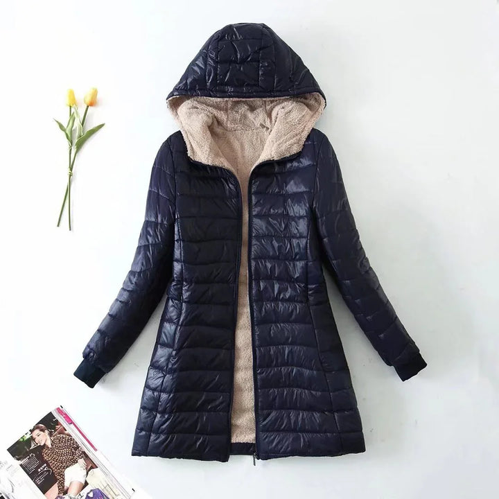 Navy blue hooded puffer jacket with beige fleece lining, displayed flat on white background