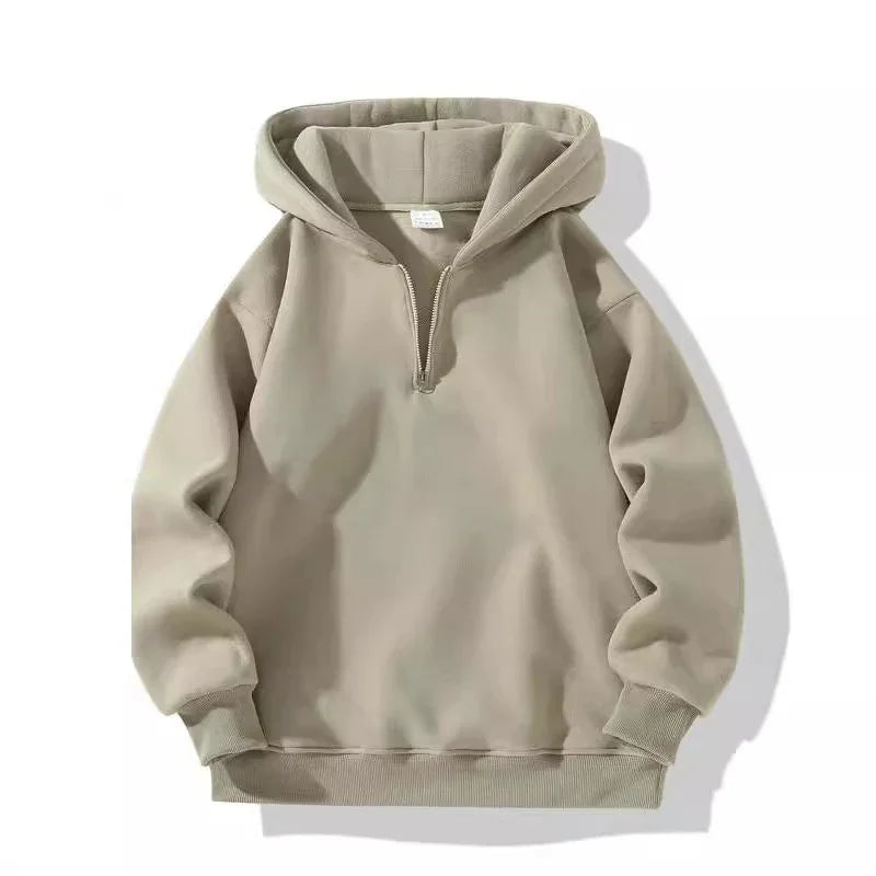 Beige half-zip pullover hoodie with ribbed cuffs and hem on white background
