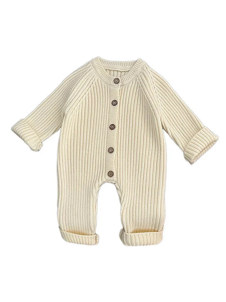 Cream-colored ribbed knit baby onesie with long sleeves and brown buttons down the front