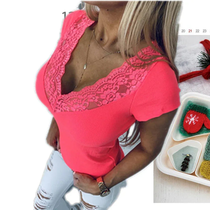 Woman wearing bright pink lace top with V-neck and white ripped jeans