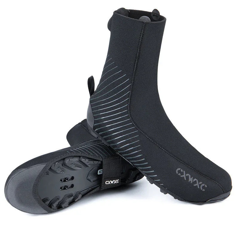 Black neoprene cycling shoe covers with reflective stripes and rugged sole for outdoor use
