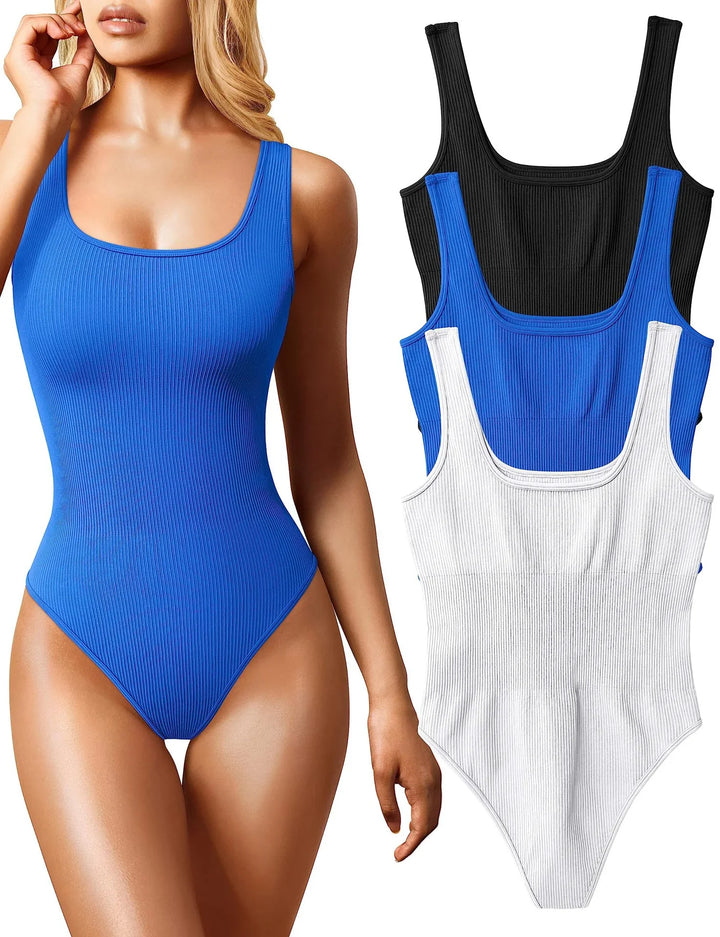 Woman wearing blue ribbed bodysuit next to black, blue, and white ribbed bodysuit set