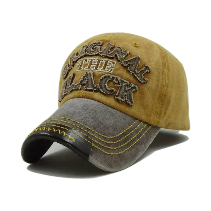 Two-tone brown and gray baseball cap with embroidered 'ORIGINAL THE BLACK' text and yellow stitching