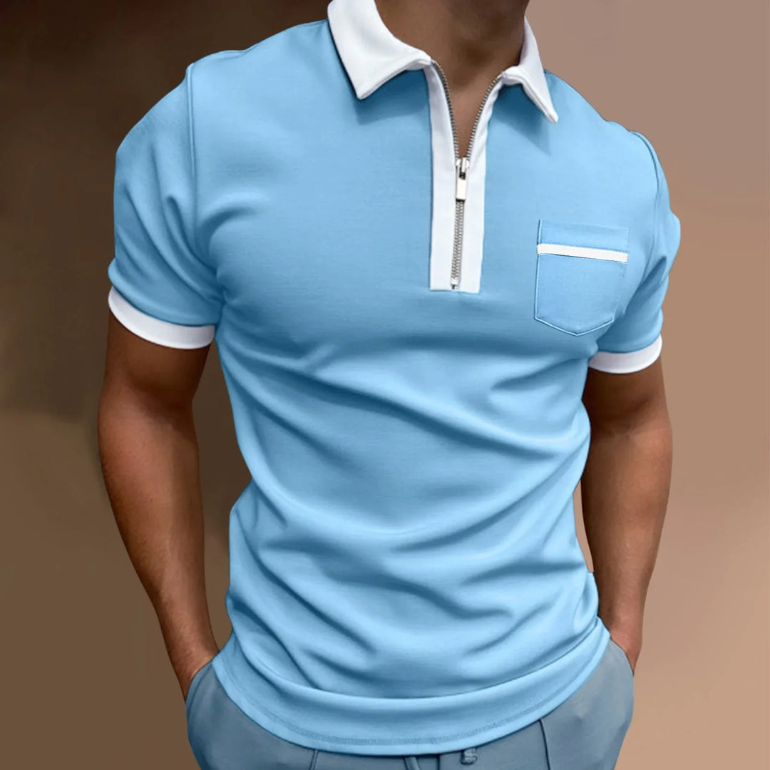 Man wearing light blue short-sleeve polo shirt with white collar, zipper, and pocket detail