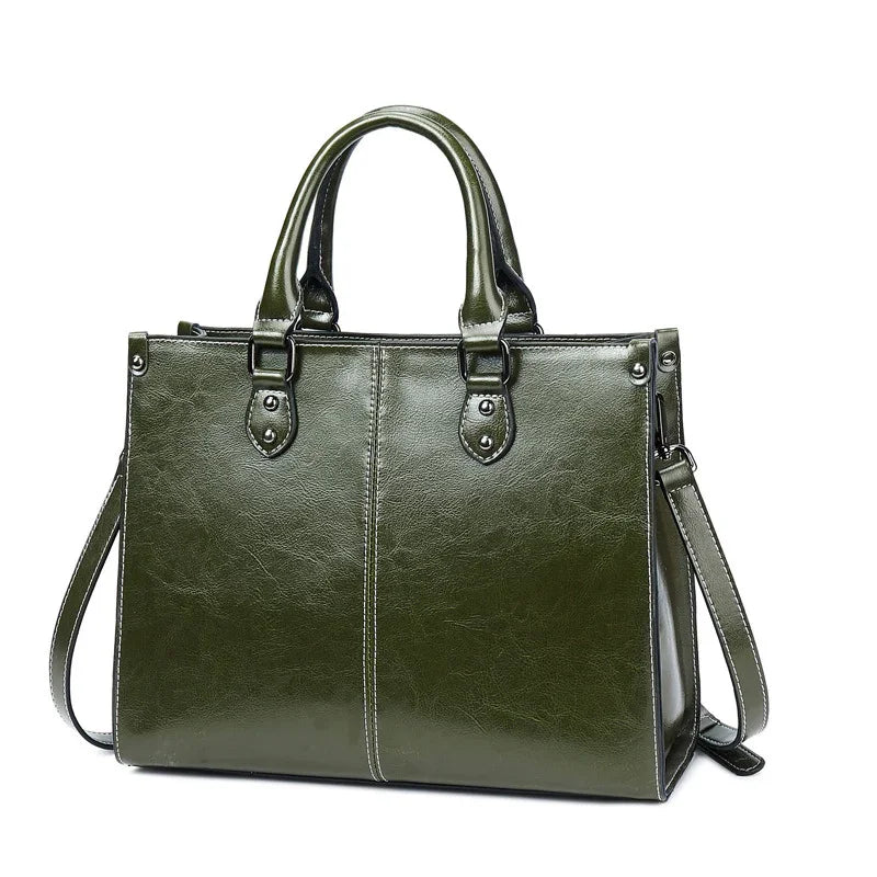 Elegant olive green leather handbag with double handles and detachable shoulder strap