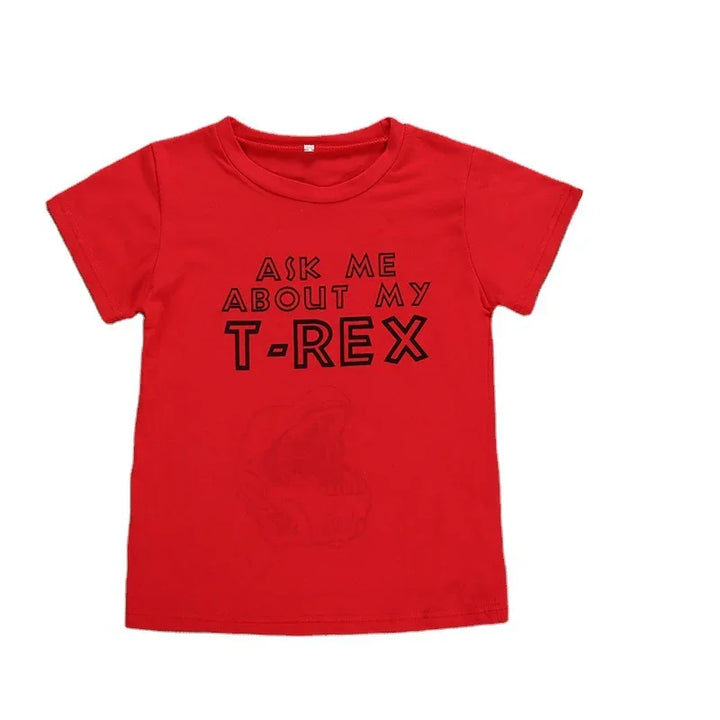 Red kids T-shirt with black text reading Ask Me About My T-Rex and faint dinosaur graphic