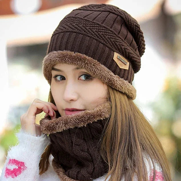 Woman wearing brown knit winter hat and matching fleece-lined neck warmer outdoors