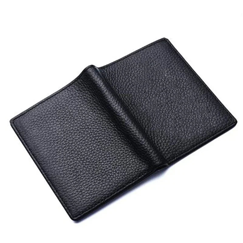 Open black pebbled leather wallet on white background with visible texture