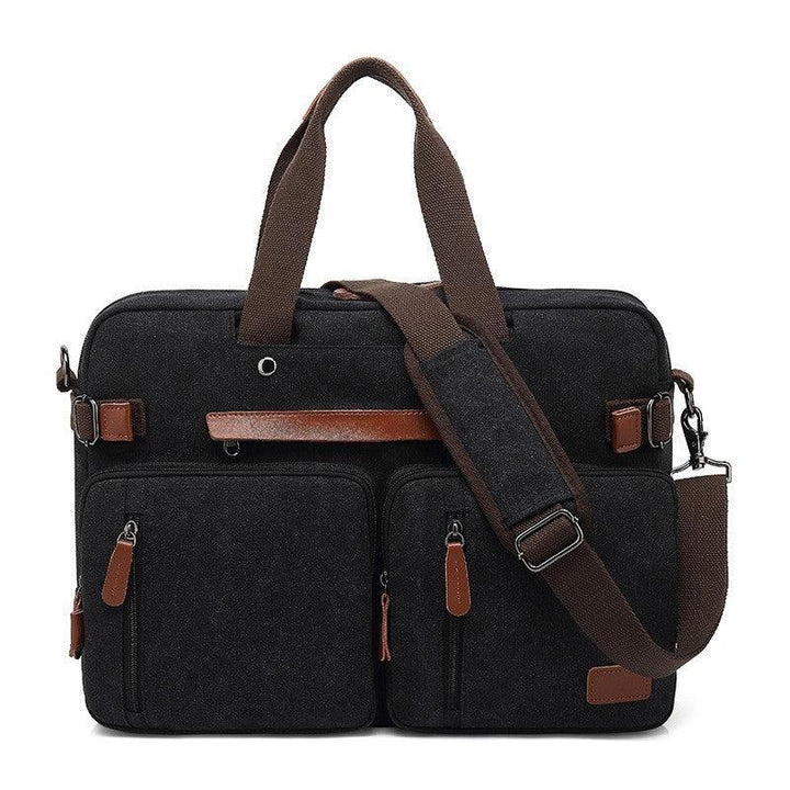 Black canvas briefcase with brown leather accents, two front pockets, and adjustable shoulder strap