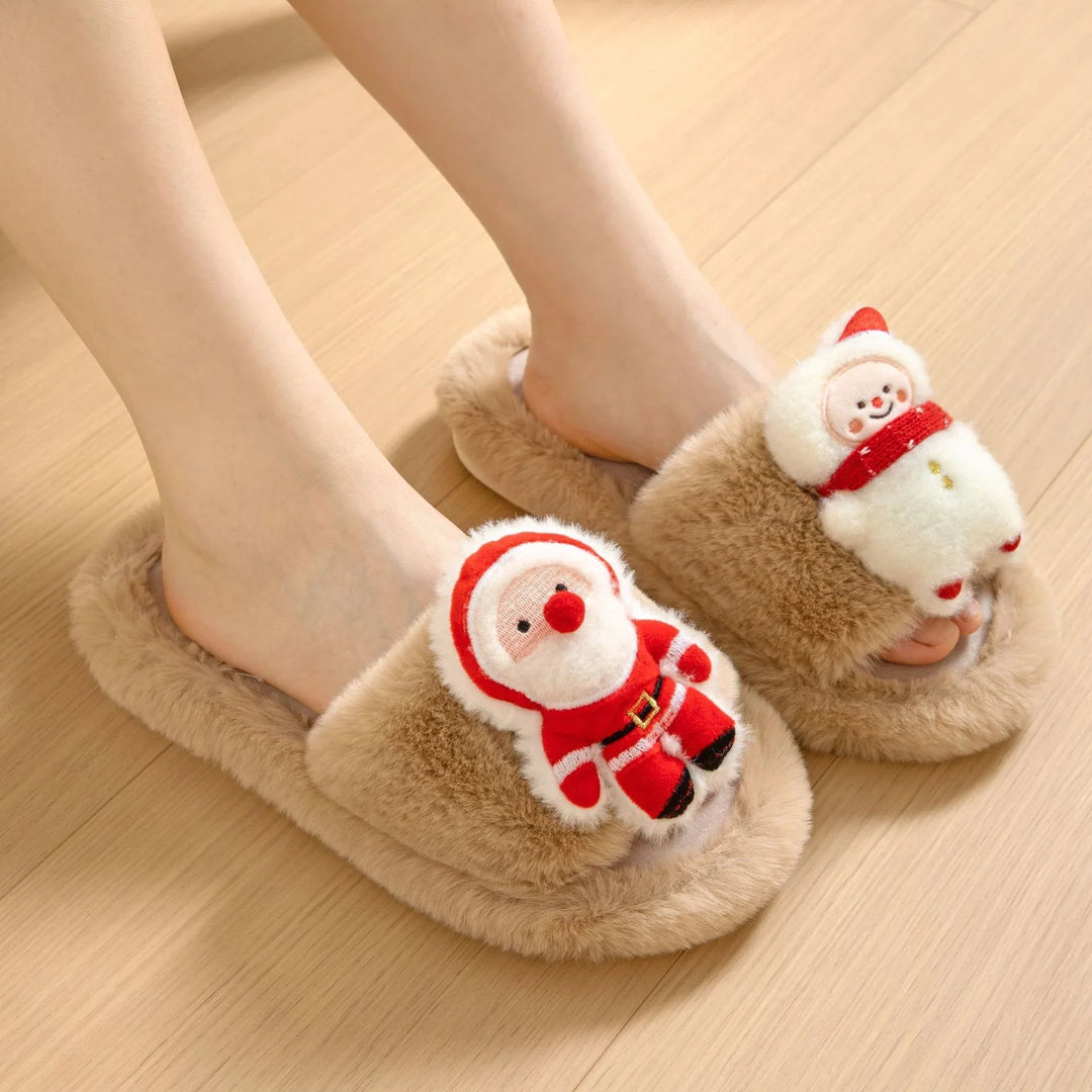 Cozy beige fuzzy slippers with plush Santa and snowman decorations on light wood floor