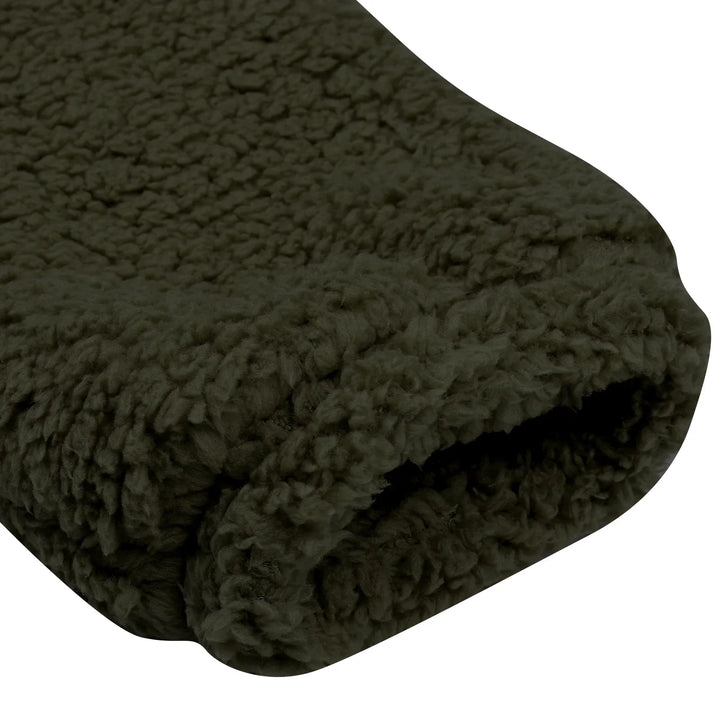 Close-up of folded dark olive green fleece blanket with soft, textured fabric