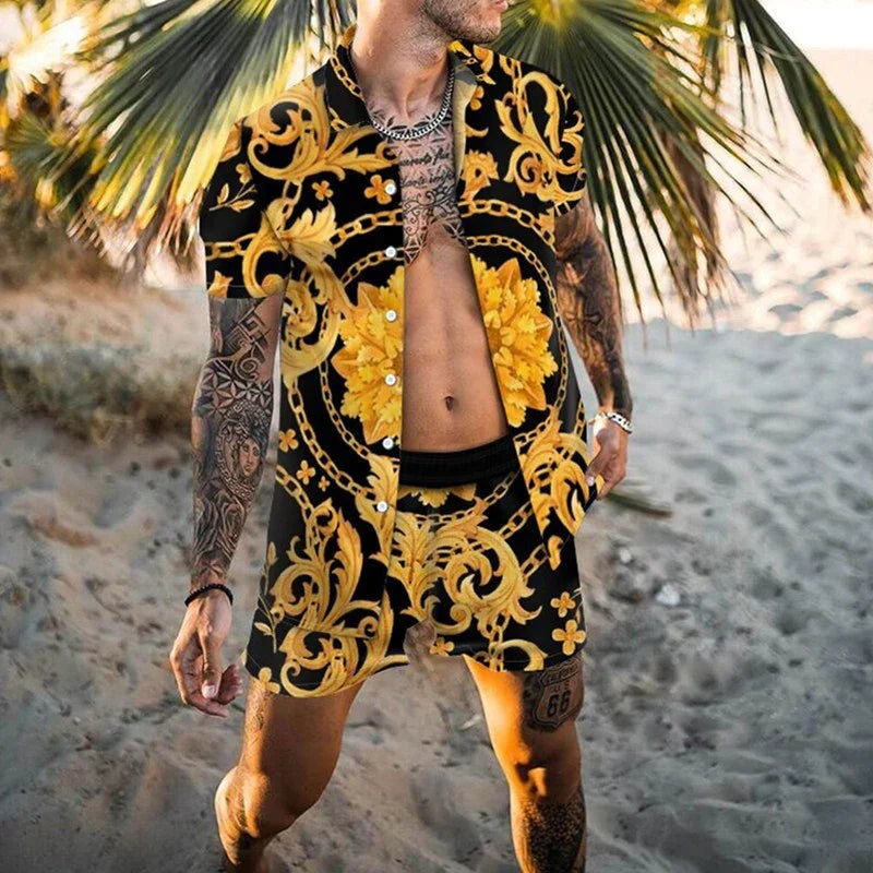 Man wearing black and gold patterned short-sleeve shirt and shorts on sandy beach with palm trees