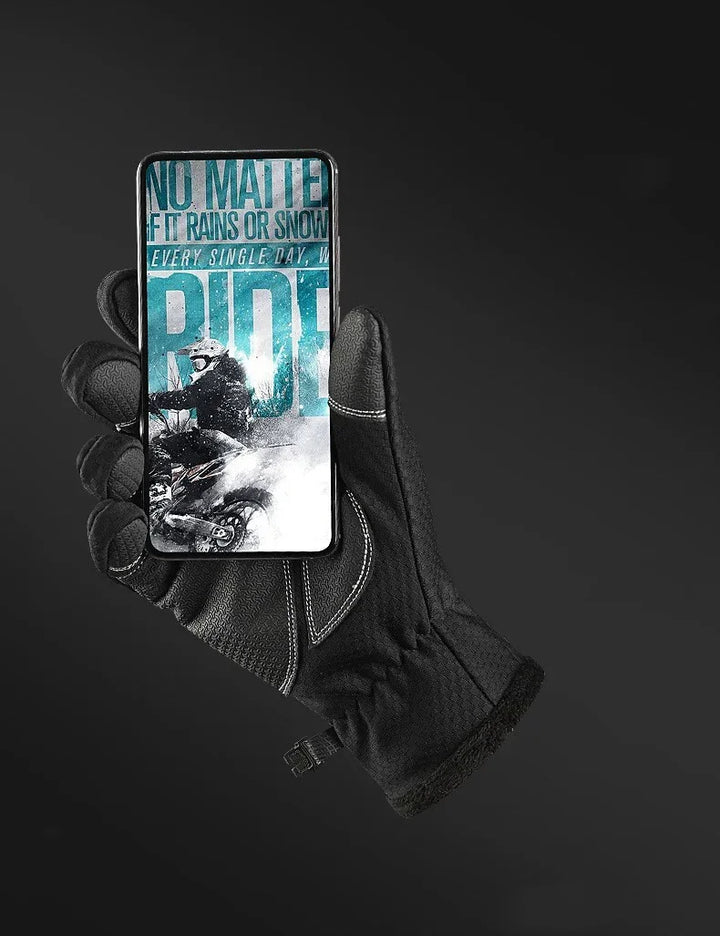 Black winter glove holding smartphone with motocross rider and weather-resistant ride text