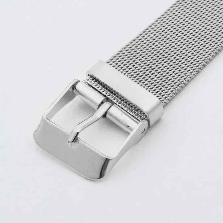 Silver metal mesh watch strap with stainless steel buckle on white background