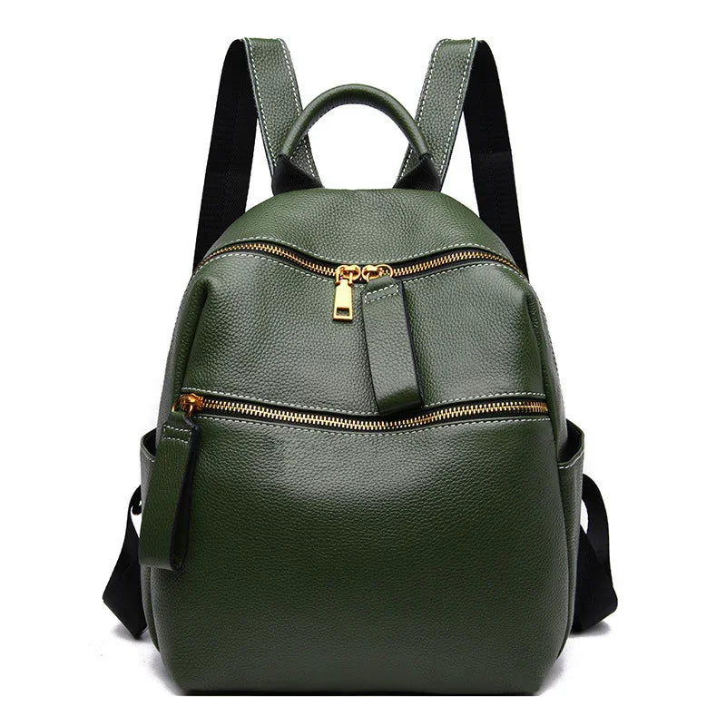 Green textured leather backpack with gold zippers and black adjustable shoulder straps