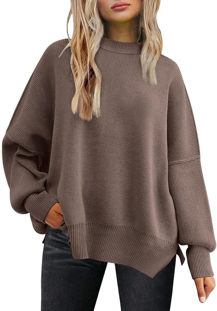 Woman wearing oversized brown knit sweater with long sleeves and black jeans