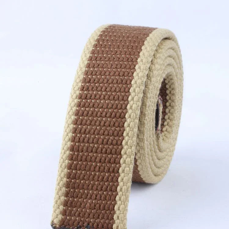 Close-up of a rolled woven fabric belt with brown center and beige edges on white background