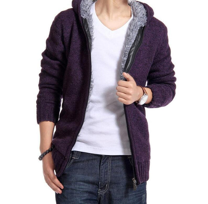 Person wearing a purple zip-up hooded sweater with gray fleece lining, white t-shirt, and jeans