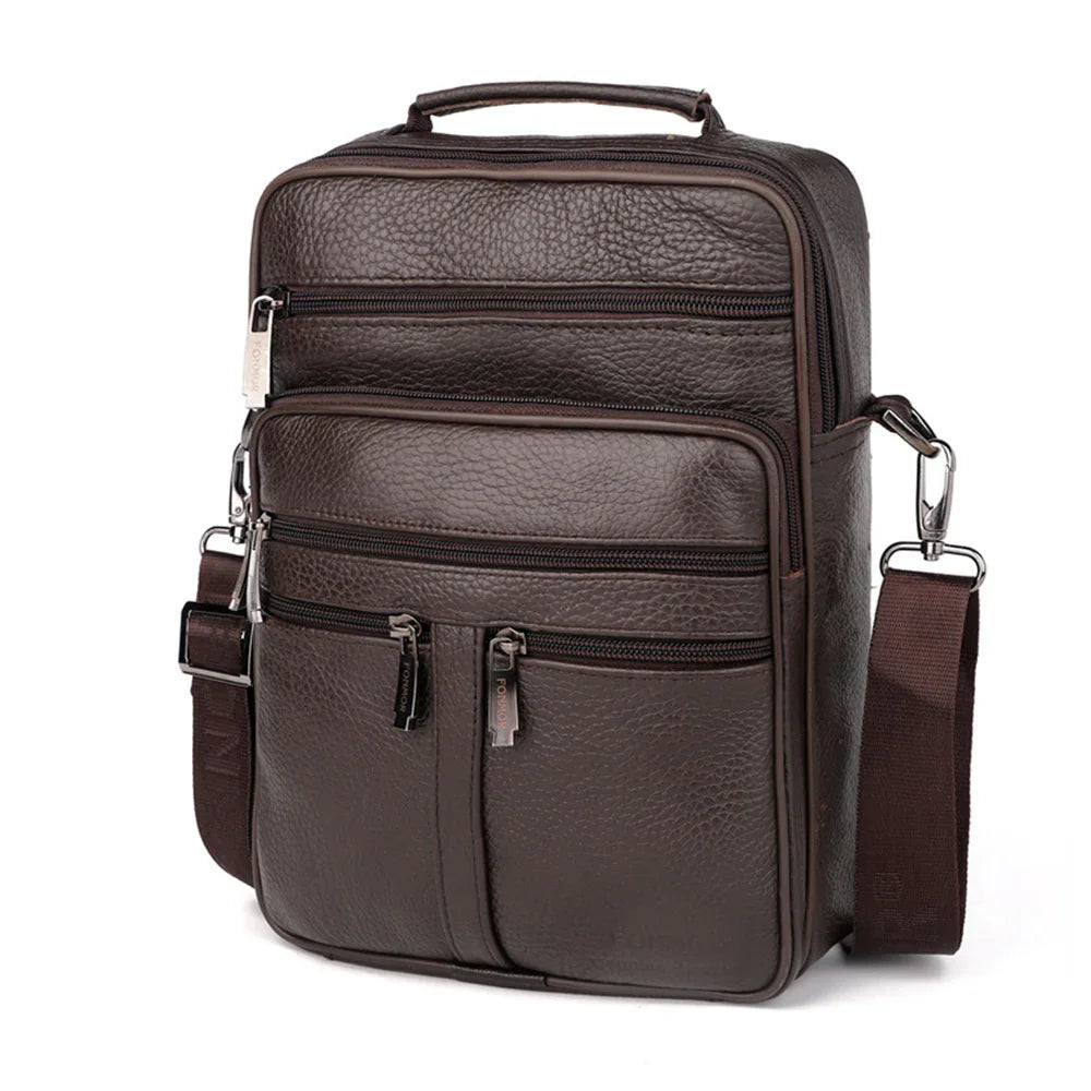 Dark brown textured leather crossbody bag with multiple zippered pockets and adjustable strap