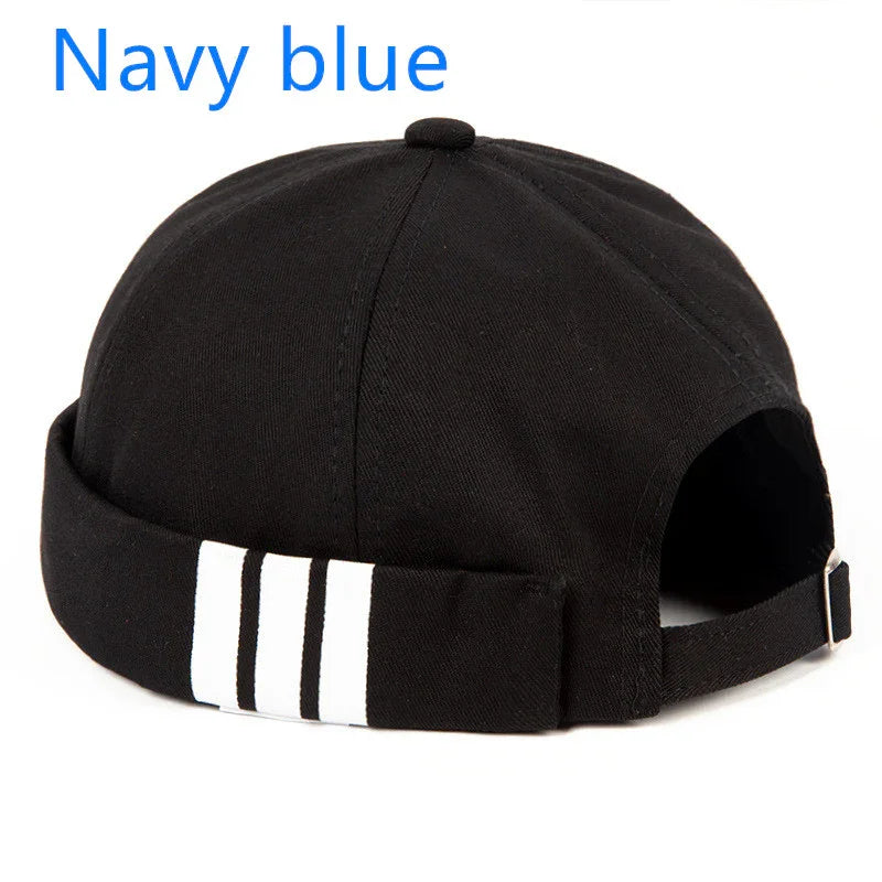 Black beanie hat with white triple stripe detail and adjustable back strap