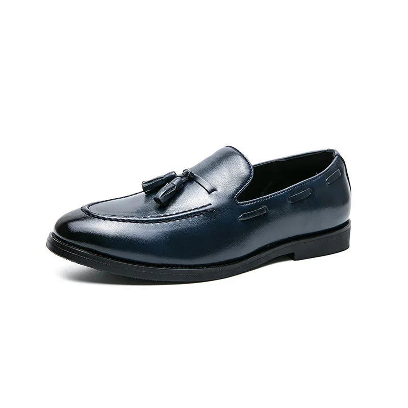 Men's black leather tassel loafer shoe with stitched details on white background