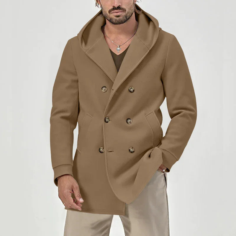 Man wearing double-breasted camel brown pea coat with hood and beige pants