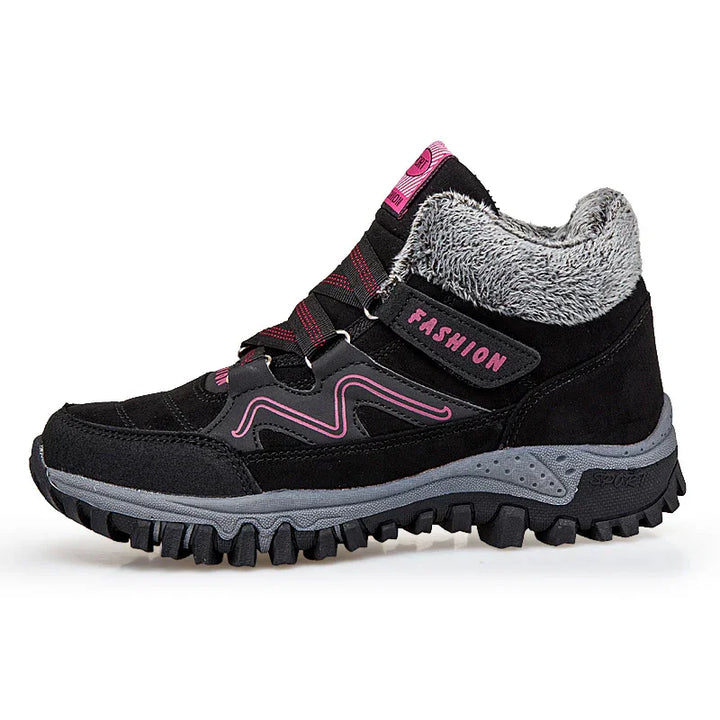 Black women's winter hiking boots with pink accents, faux fur lining, and rugged sole