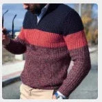 man wearing colorblock knit sweater with red and navy stripes outdoors in casual fall setting
