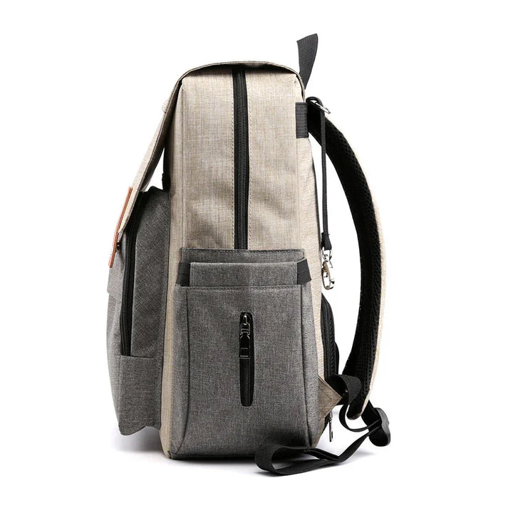 Side view of beige and gray durable polyester backpack with multiple zippered pockets and padded straps