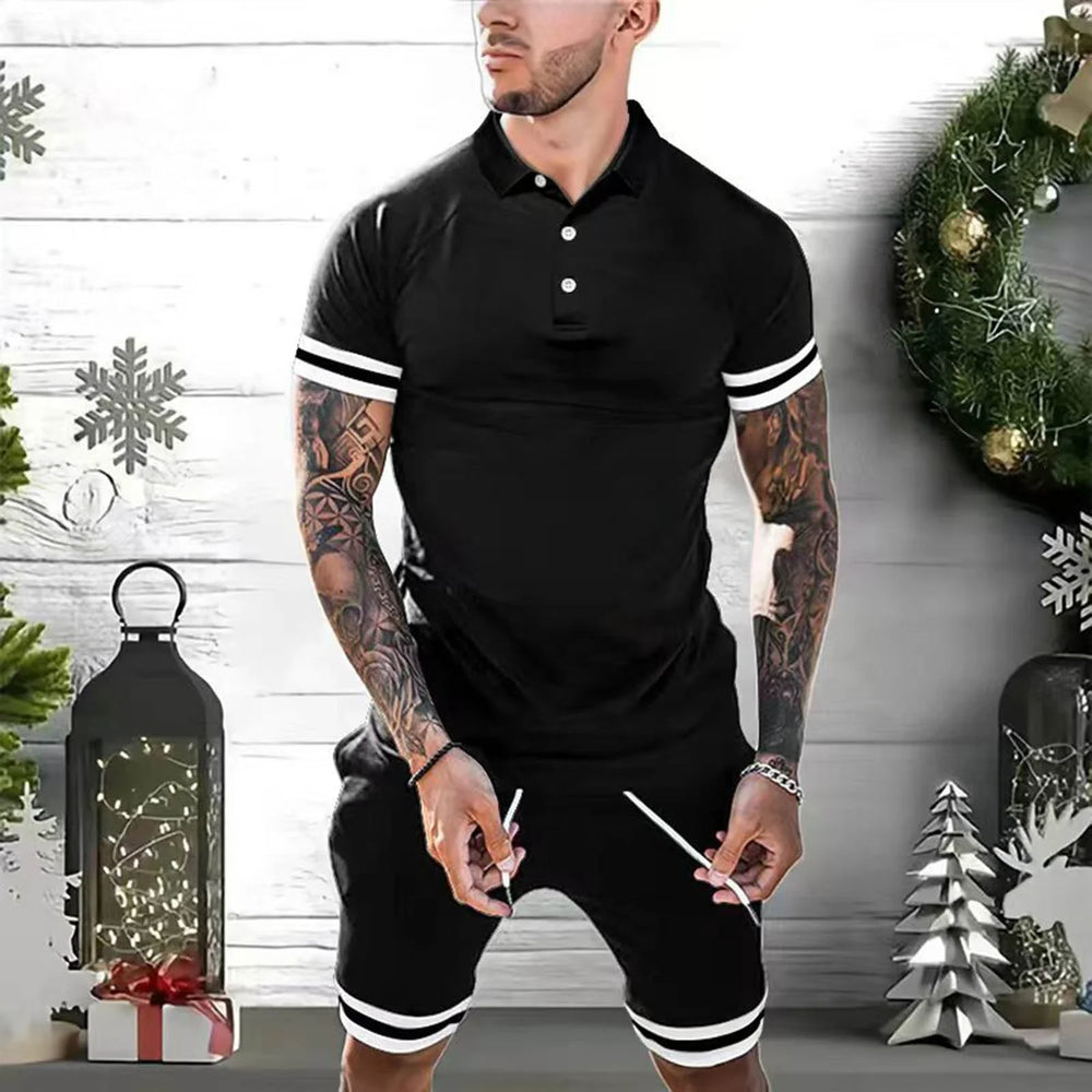 Man wearing black polo shirt and shorts with white stripes in festive holiday setting