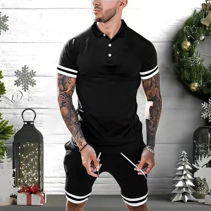 Man wearing black polo shirt and shorts with white stripes in festive holiday setting