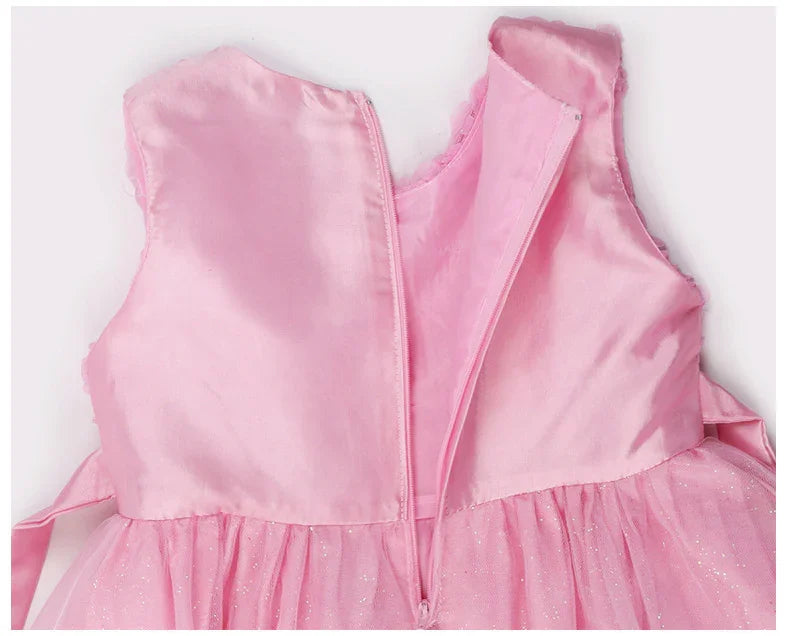 Close-up of back zipper on sleeveless pink sparkly tulle dress for girls