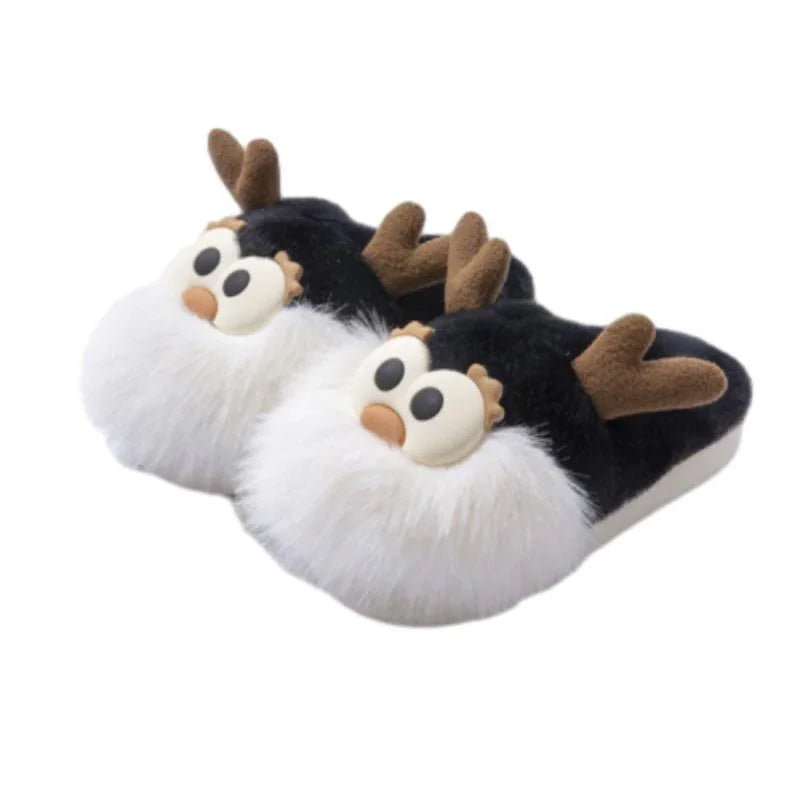 Black and white plush slippers with cartoon reindeer face and brown antlers, cozy winter footwear