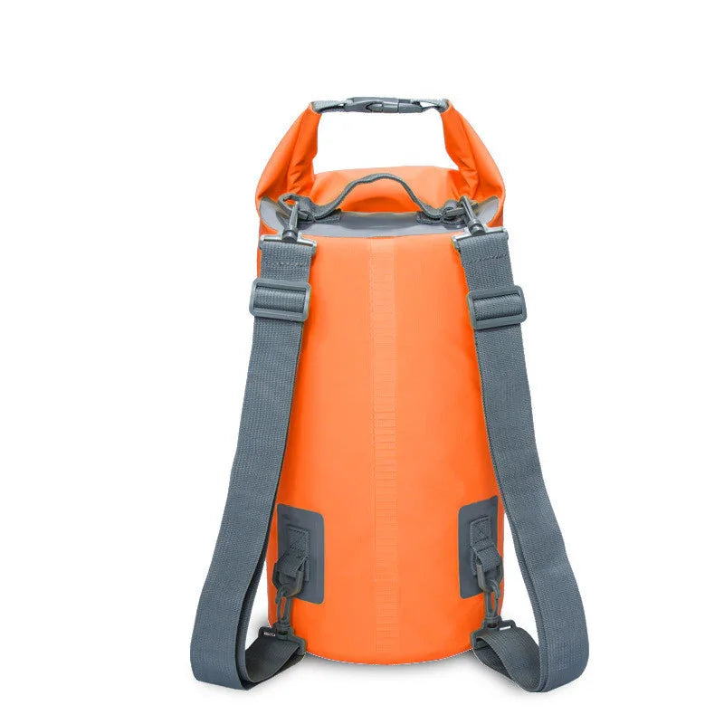Orange waterproof dry bag backpack with grey straps on white background