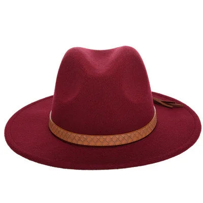 Stylish deep red fedora hat with wide brim and brown leather band detail