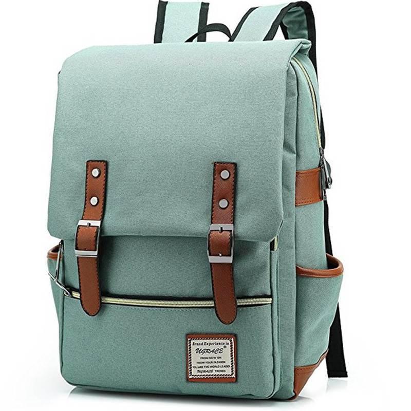 Light green canvas backpack with brown leather straps and front pocket, padded shoulder straps