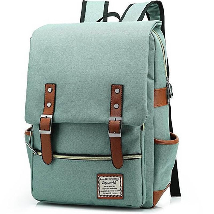 Light green canvas backpack with brown leather straps and front pocket, padded shoulder straps