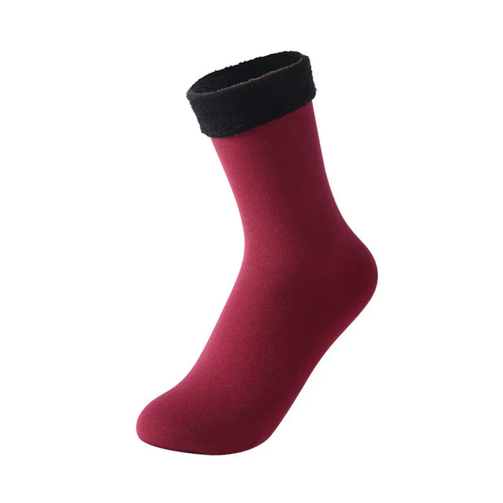 Single burgundy sock with black fuzzy cuff on white background, winter warm socks