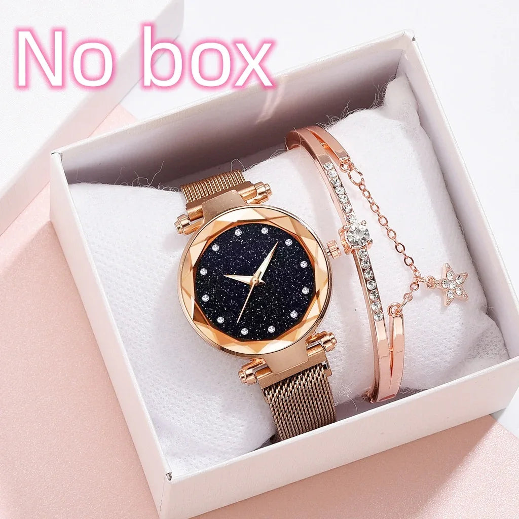 Rose gold mesh band watch with glittery black dial and matching rhinestone bracelet in white box
