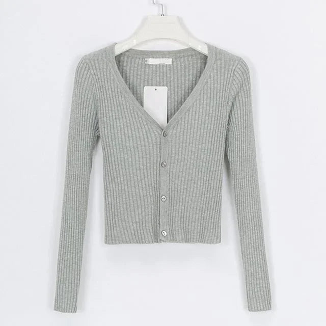 Gray ribbed knit cropped cardigan with long sleeves and buttons on white hanger