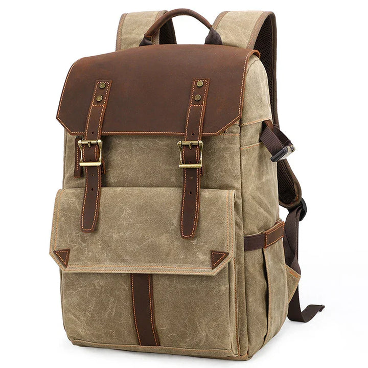 vintage canvas and leather backpack with buckle straps and front pocket