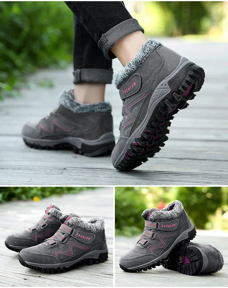 Gray winter hiking boots with pink accents and fleece lining on wooden deck outdoors