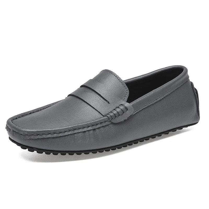 Gray leather men's moccasin loafer shoe with textured finish and rubber sole
