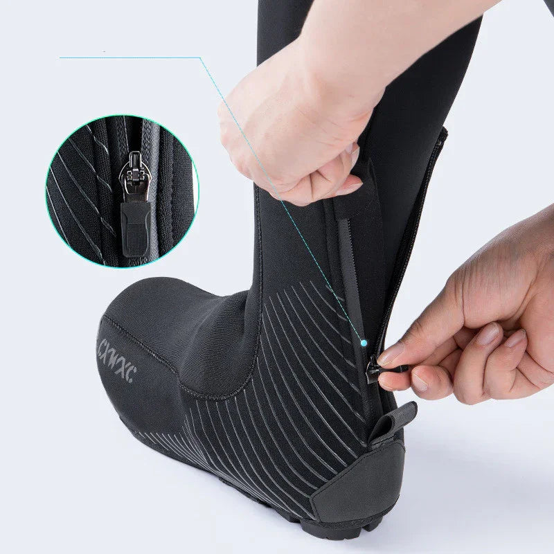 Black neoprene cycling shoe cover with diagonal stripes and back zipper detail