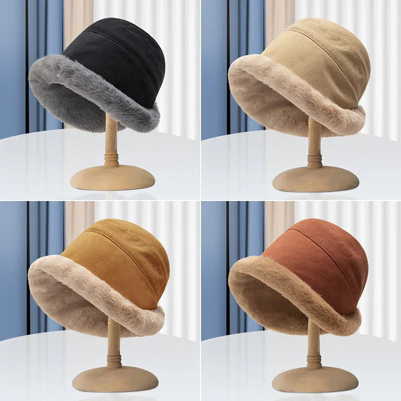 Four cozy winter bucket hats in black, beige, brown, and rust with faux fur lining on wooden stands
