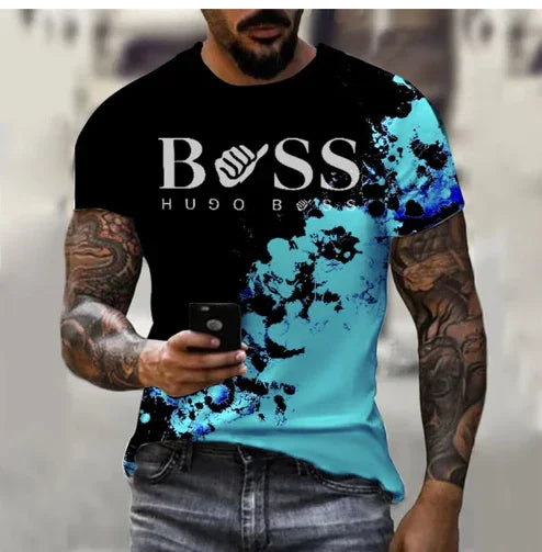 Man wearing black and blue Hugo Boss graphic t-shirt with tattoos on arms holding phone