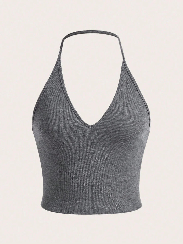 Gray ribbed knit halter crop top with v-neck on beige background